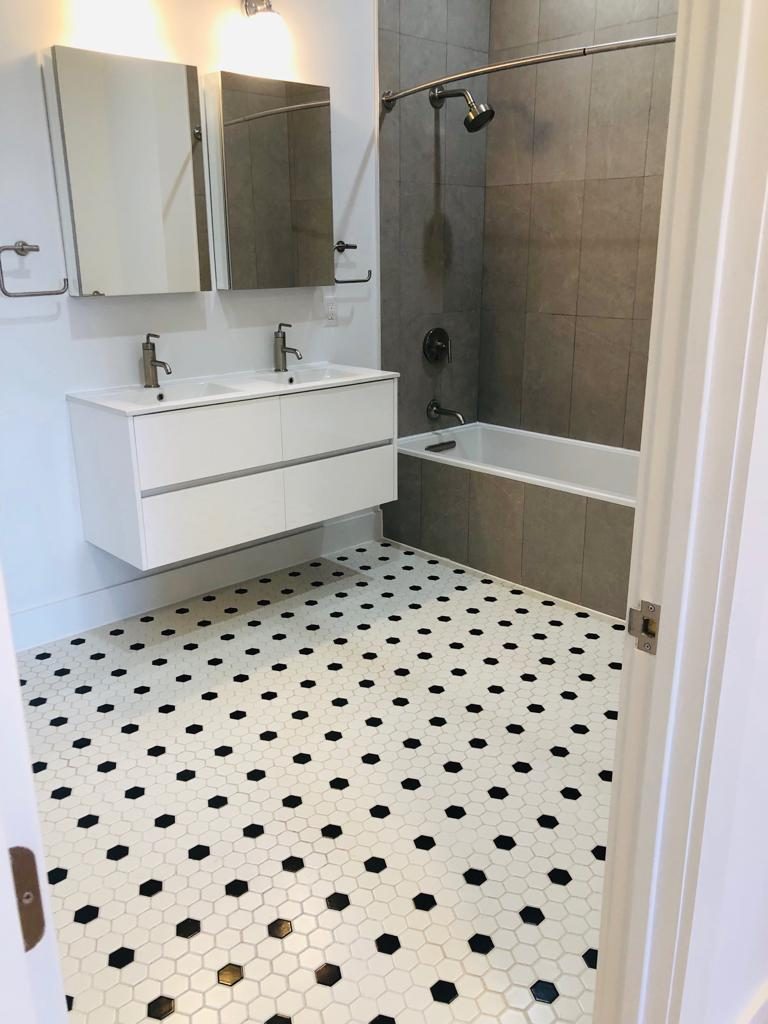 Finished bathroom with double vanity plumbed by I&I Plumbing