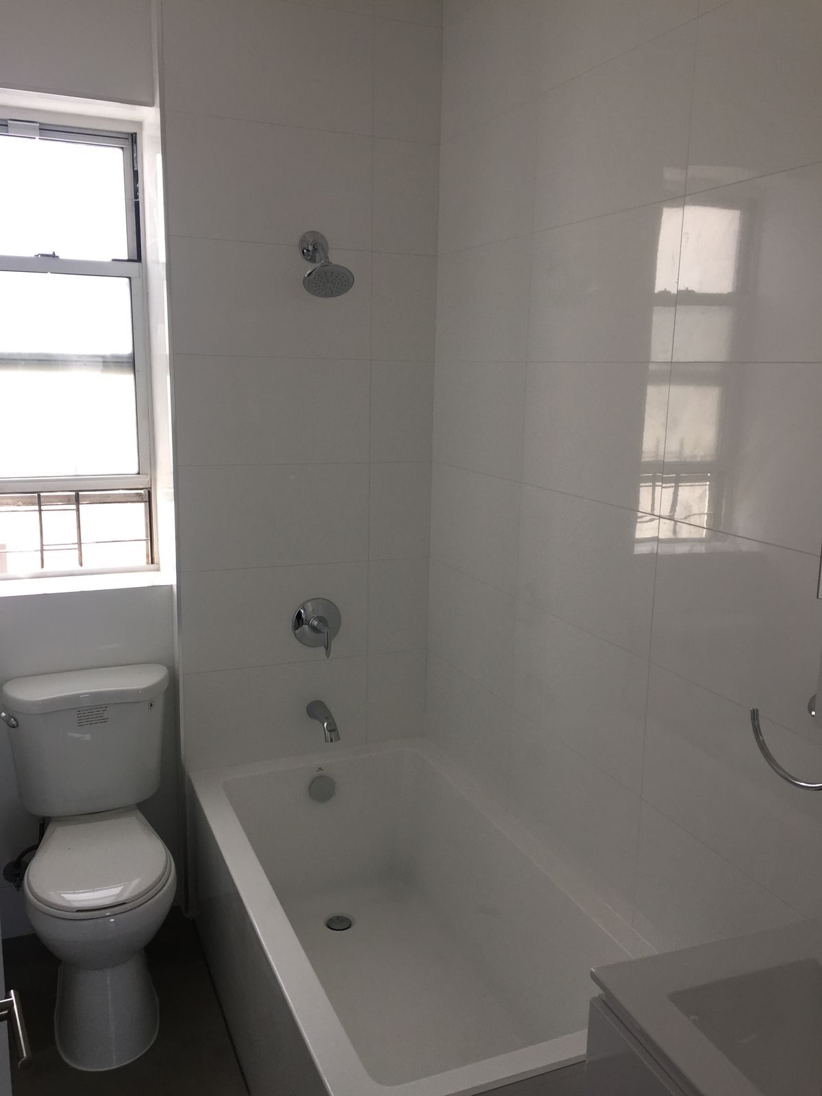 Renovated bathroom with new tub and fixtures by I&I Plumbing