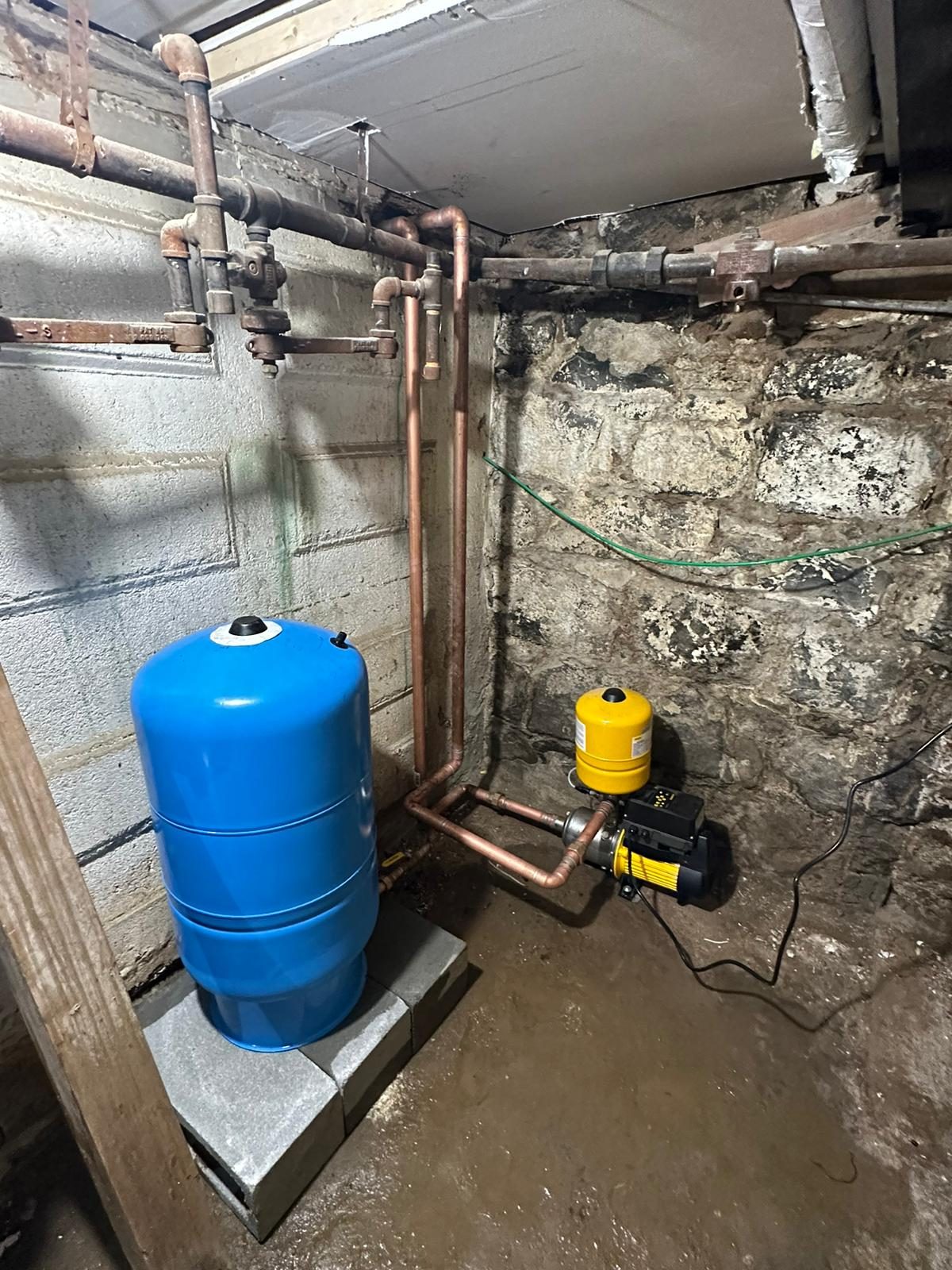 New water service with pressure tank and booster pump in an NYC basement